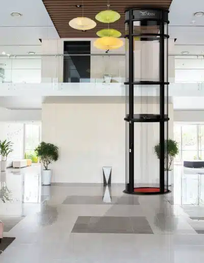 Modern pneumatic elevator with transparent tube design - Nibav Lifts